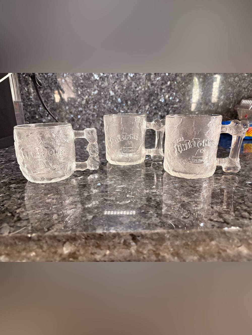 Vintage 1993 McDonald's glass mugs featuring The Flintstones